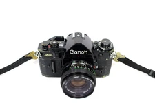 Canon A-1 35mm SLR Film Camera W/Canon FD 50mm 1:1.8 Lens WORKS BUT SOLD AS-IS