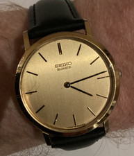 Seiko quartz mens dress watch gold colour case/dial and s/s back, new strap gwo