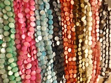 MOTHER OF PEARL, FLAT ROUND BEADS DYED/NATURAL 11 MM , 15 INCH STRANDS 9 COLORS
