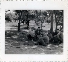 WW2 Photo Of US Soldiers And Civilians Resting Under Orchard Trees