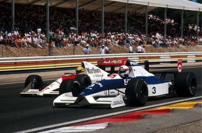 Ayrton Senna goes past the Tyrrell of Satoru Nakajima Tyrrell 019 - Old Photo