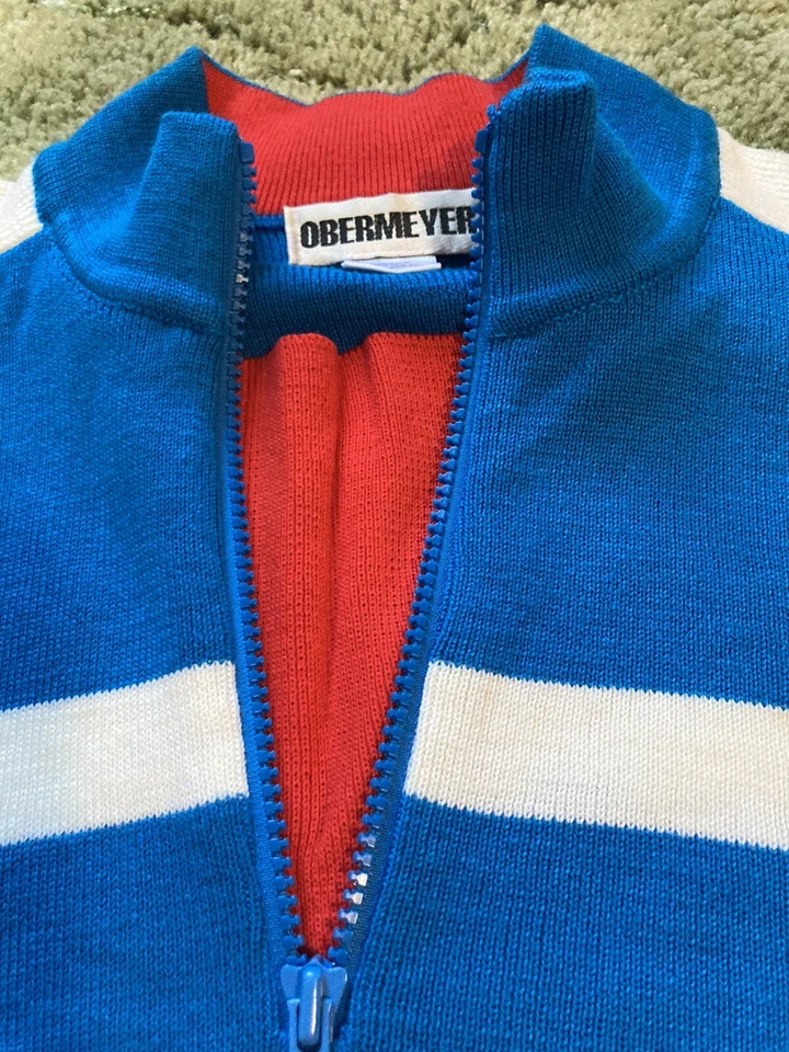 Suéter de esquí Obermeyer para niños Stinger talla 12, azul y blanco, ribete rojo. Foto 2 de 4