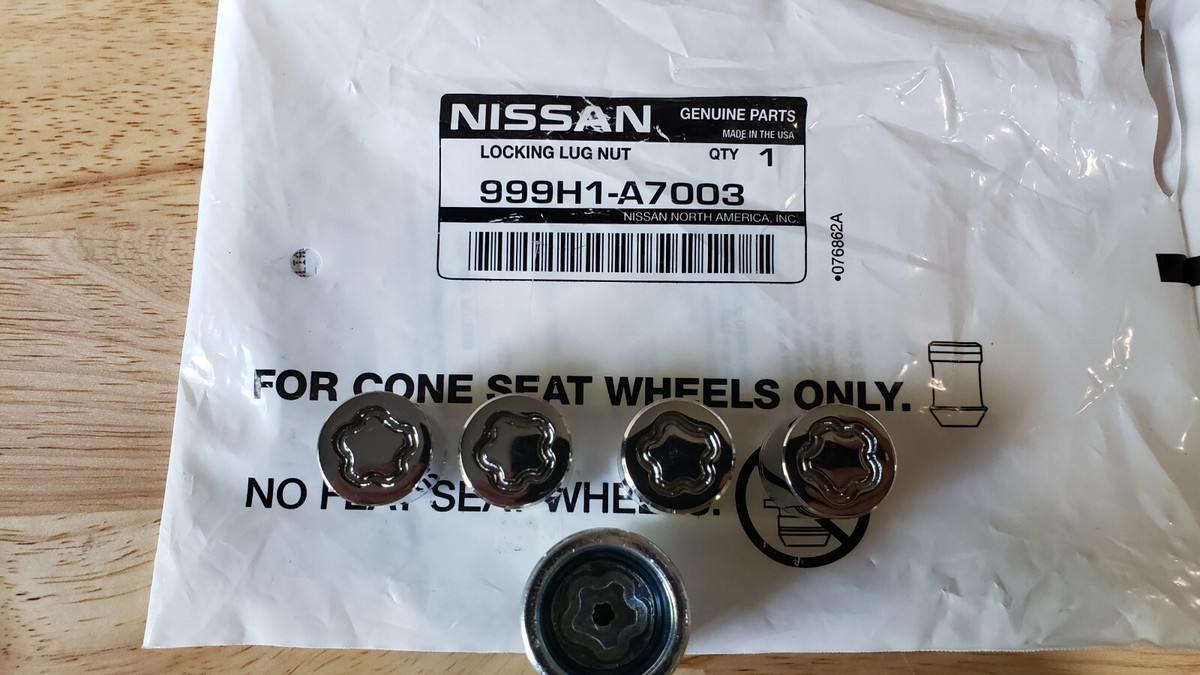 NEW GENUINE NISSAN WHEEL LOCK SET OF 4 IN SEALED NISSAN BAG 999H1