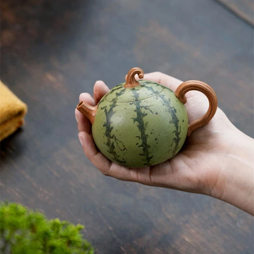 Tetera hecha a mano de cerámica Yixing Zisha con forma de sandía 7 orificios infusores - Imagen 1 de 11