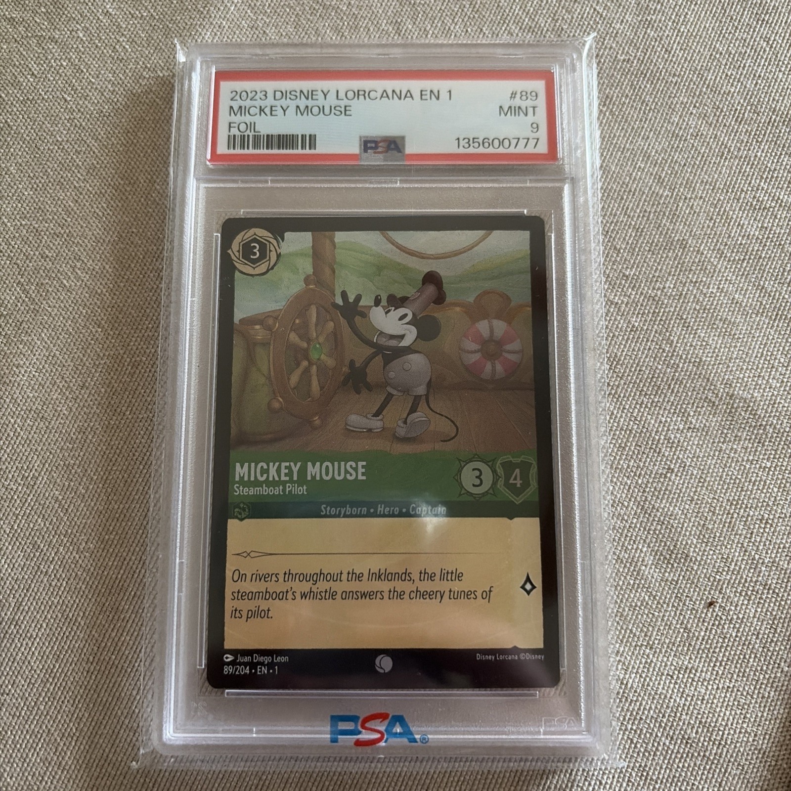 2023 Disney Lorcana Mickey Mouse Steamboat Pilot Foil 89/204 PSA 9 Mint