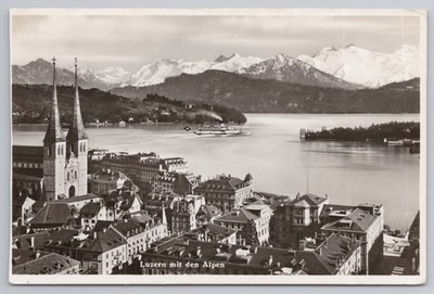 Luzern mit den Alpen Vierwaldstätter See Dampfer Hofkirche Schweiz Globetrotter