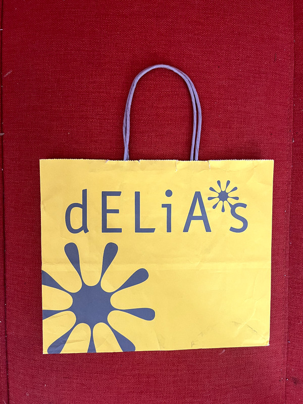 dELiA*s paper shopping yellow bag