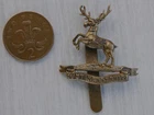 A WW1 brass die struck other ranks Huntingtonshire Cyclist Battalion cap badge