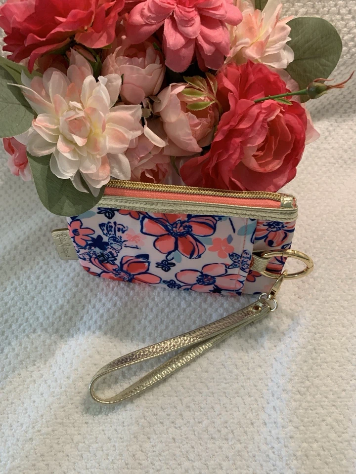 Muñequera Lily Pulitzer con cremallera superior detalles en oro rosa, blanco y azul Foto 2 de 4