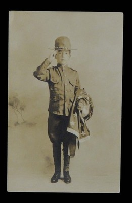REAL PHOTO POSTCARD LITTLE YOUNG BOY SCOUT OF AMERICAN SALUTES YOU AMERICAN FLAG