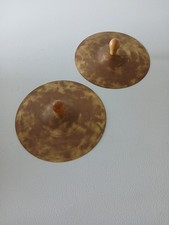 A Pair Of Wooden Handle Hand Cymbals