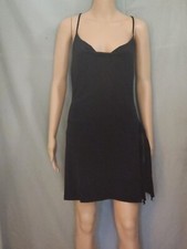 New little black dress with spagetti straps/side sash size L. Criss cross back.