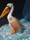 A rustic, stylized pelican figurine — photo 3