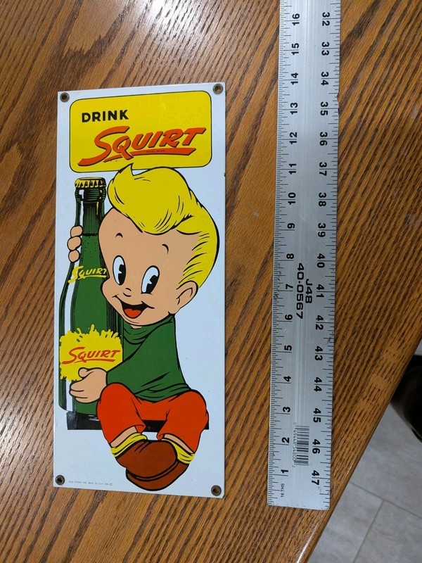 Drink Squirt Porcelain Enameled Advertising Sign 1986 USA 14"X6" Ande Rooney