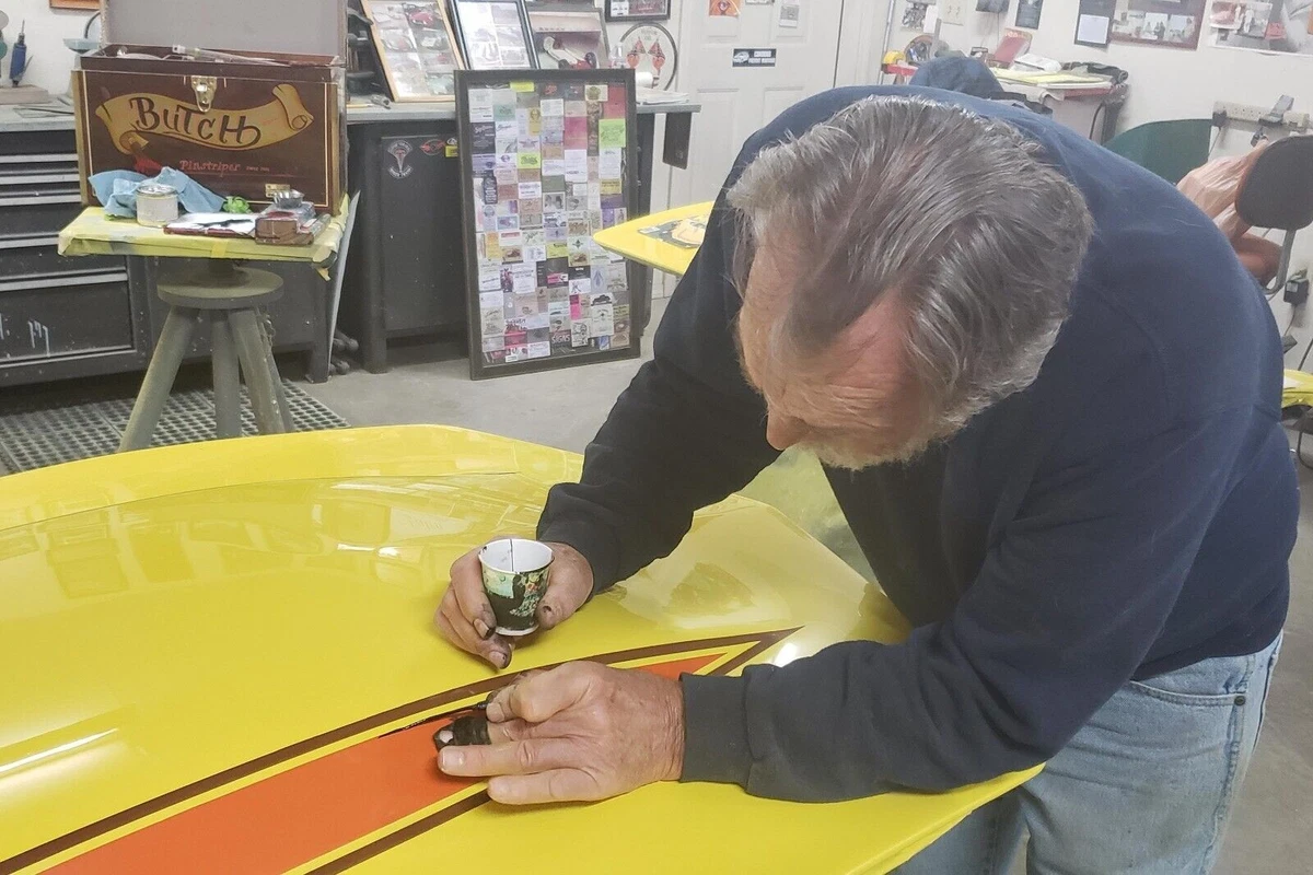 Pinstriping the wide body Vette