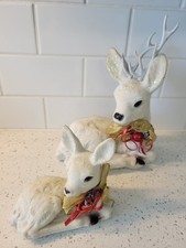 pair of vintage white flocked Christmas reindeer in resting pose