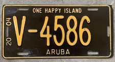 2004 ARUBA LICENSE PLATE #V-4586, ONE HAPPY ISLAND. YELLOW AND BROWN