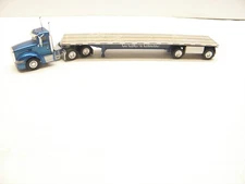 TRUCKS N STUFF #SPT3057- PETERBILT 386 W/FLATBED WESTERN -W/LOAD - HO SCALE