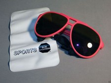 Sports sunglasses, blue stoppers, U.V. protection, all weather lens pink frames