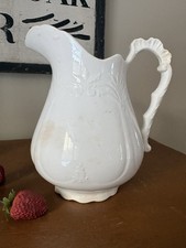 Goodwin Pottery Co. 1844 - White Ironstone Pitcher Scroll Embossed 8" Stained