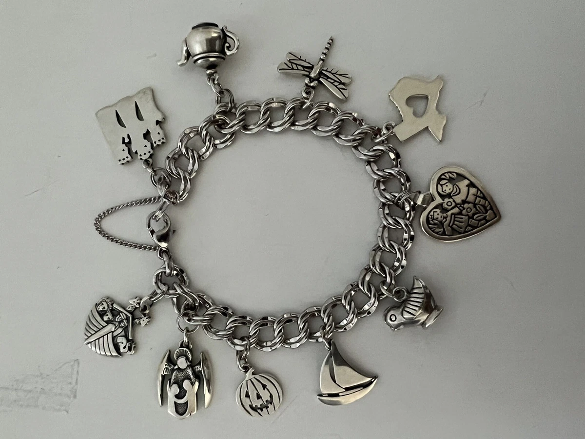 JAMES AVERY STERLING SILVER CHARM BRACELET WITH 8 CHARMS - LB-C1148