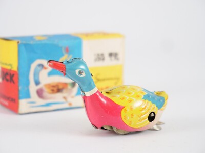 Jouet ancien en tôle, un canard mécanique fonctionnel avec clé d