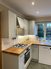 Shaker Grey Wickes  kitchen units with oak worktop; sink, hob, fan extractor