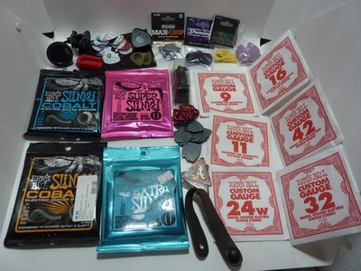 Guitar lot strings,  tuner,  picks   Steel Guitar/Guitar ACCESSORIES