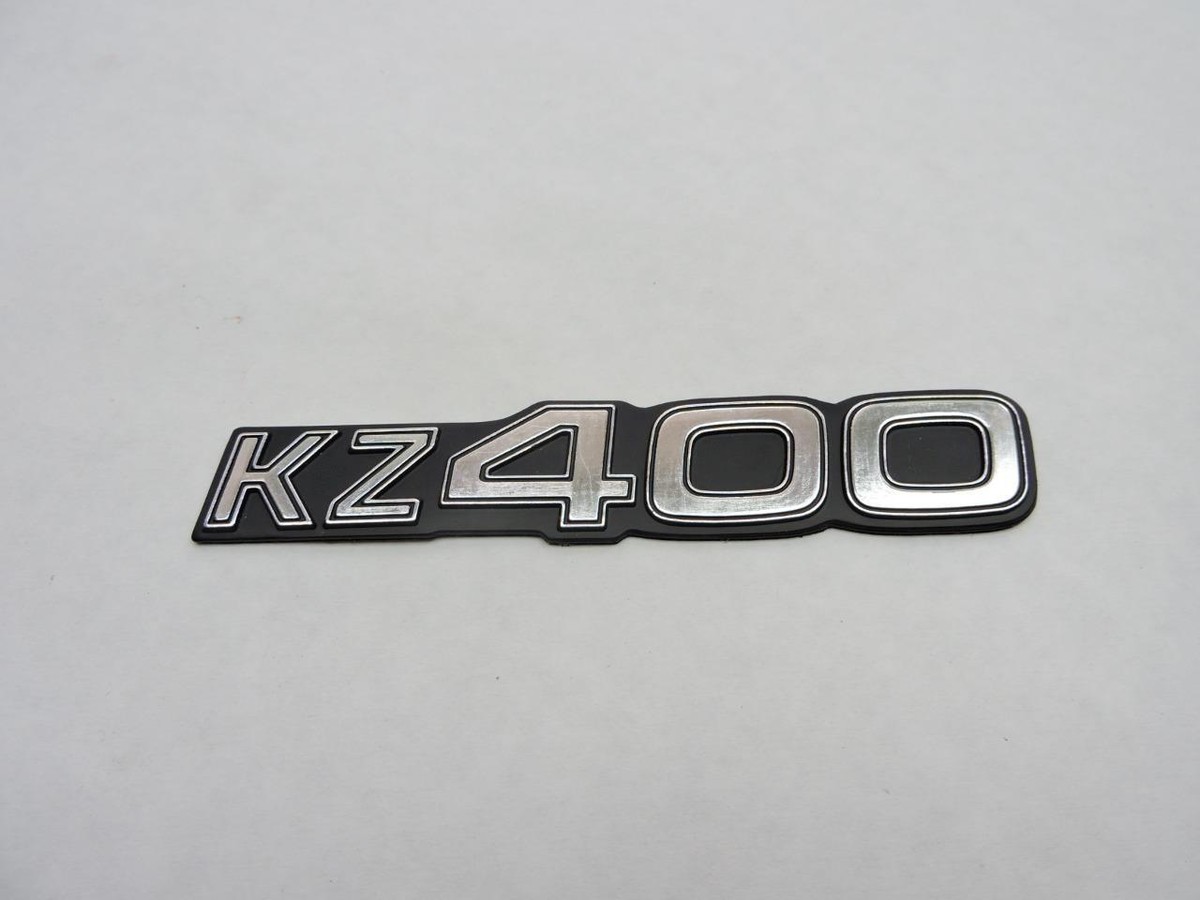 NOS 1976-77 Kawasaki Kz400 Side Cover Emblem KZ 400 for sale