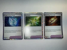 NM Pokemon Trainer Holo Drops in the Ocean Sun Seed Scorching Charcoal 021/034