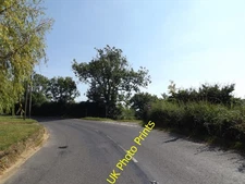 Photo 12x8 B1134 Long Row, Goose Green Goose Green/TM1187 At the junction c2016