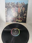 The Beatles Sgt. Peppers Lonely Hearts Club Band Vinyl Music Record Album.