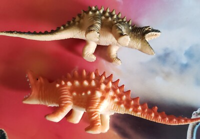 Dinosaur figures and an INVICTA DINOSAUR POSTER
