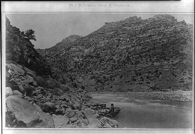 Photo:[Canyon of Desolation; expedition member in boat]