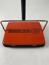 Barredora de piso de alfombras de acción electrostática Fuller Brush Company rojo naranja metal