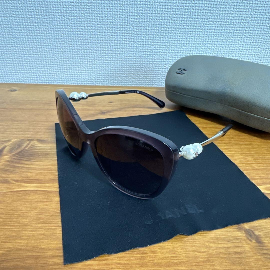 CHANEL Black Cat Eye Sunglasses with Gold Accents-image