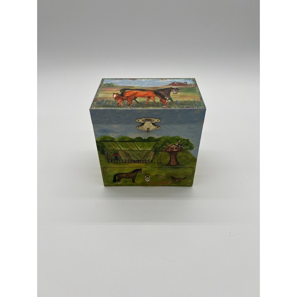 An Enchantmints musical jewelry box with a spinning horse — a beautifully crafted trinket box that's part toy, part jewelry storage, all whimsy.