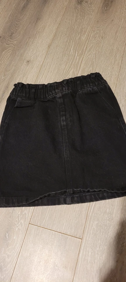 Kiabi Jupe en jean fille noire 10 ans taille élastiquée bouton au genou - Photo 1/2
