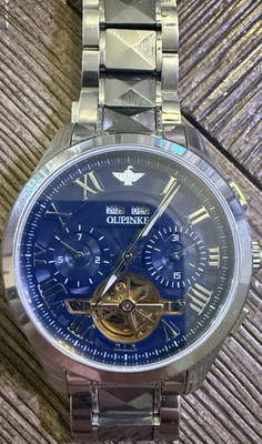OUPINKE Automatic Skeleton Wristwatch Blue Chrono Dial Stainless Steel Band.