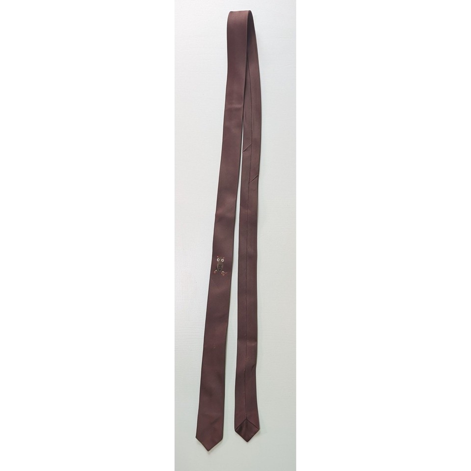 A skinny brown tie embroidered with owls — peak Mad Men novelty that's quirky enough to actually get compliments.