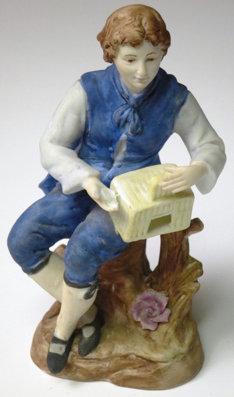 Boy Figurine Sitting on Stump with Bird Cage in Hand Ceramic Porcelain VINTAGE