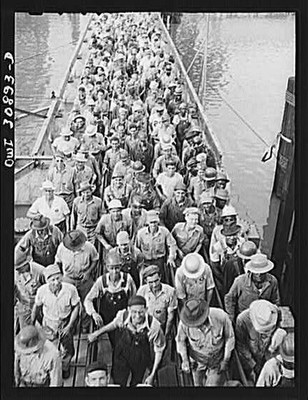 Beaumont, Texas. Shipyard workers leaving the Pennsylvania shipyards at the