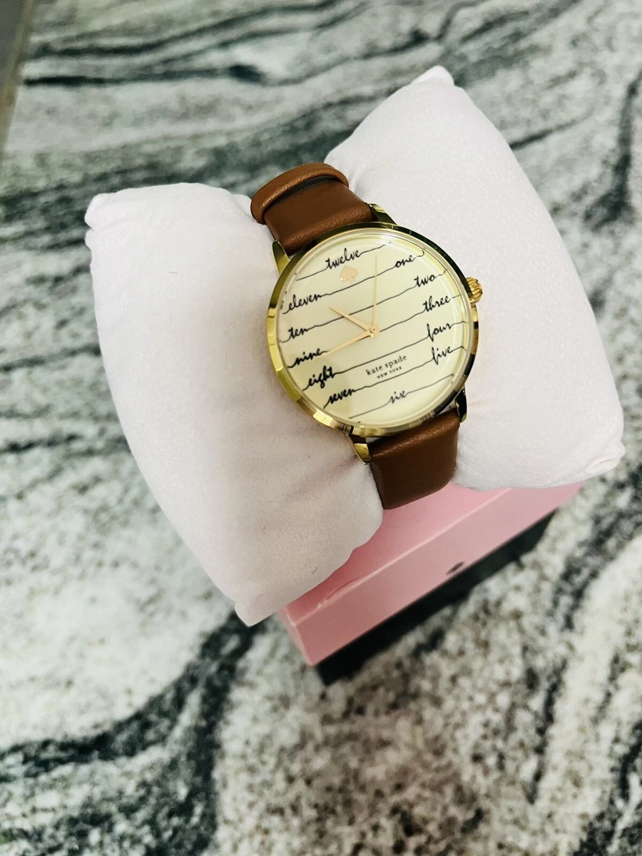 Kate Spade New York Womens Metro Gold Watch Cream Script Dial Brown Leather Band