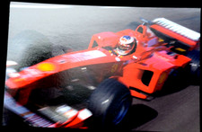 61029 Postcard Michael Schumacher in Ferrari on the racetrack 1998