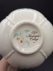 White ceramic vase with green floral pattern, “LENOX MORNINGSIDE COTTAGE” text, and two small green dragonflies.