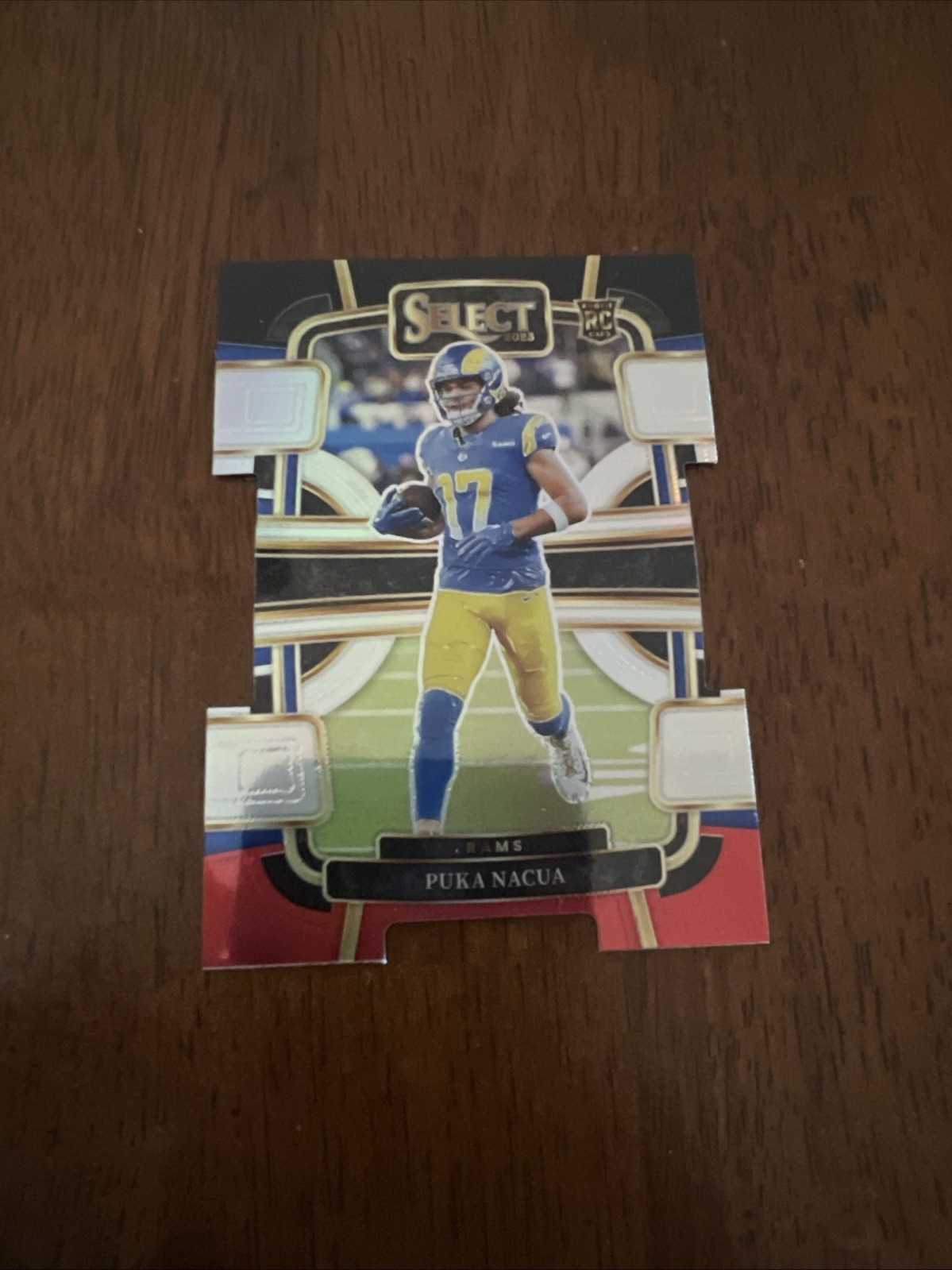 2023 Panini Select - Concourse Puka Nacua #56 Black & Red Prizm Die-Cut RC Rams