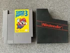 Vintage Nintendo NES Super Mario 3 game with black game sleeve.