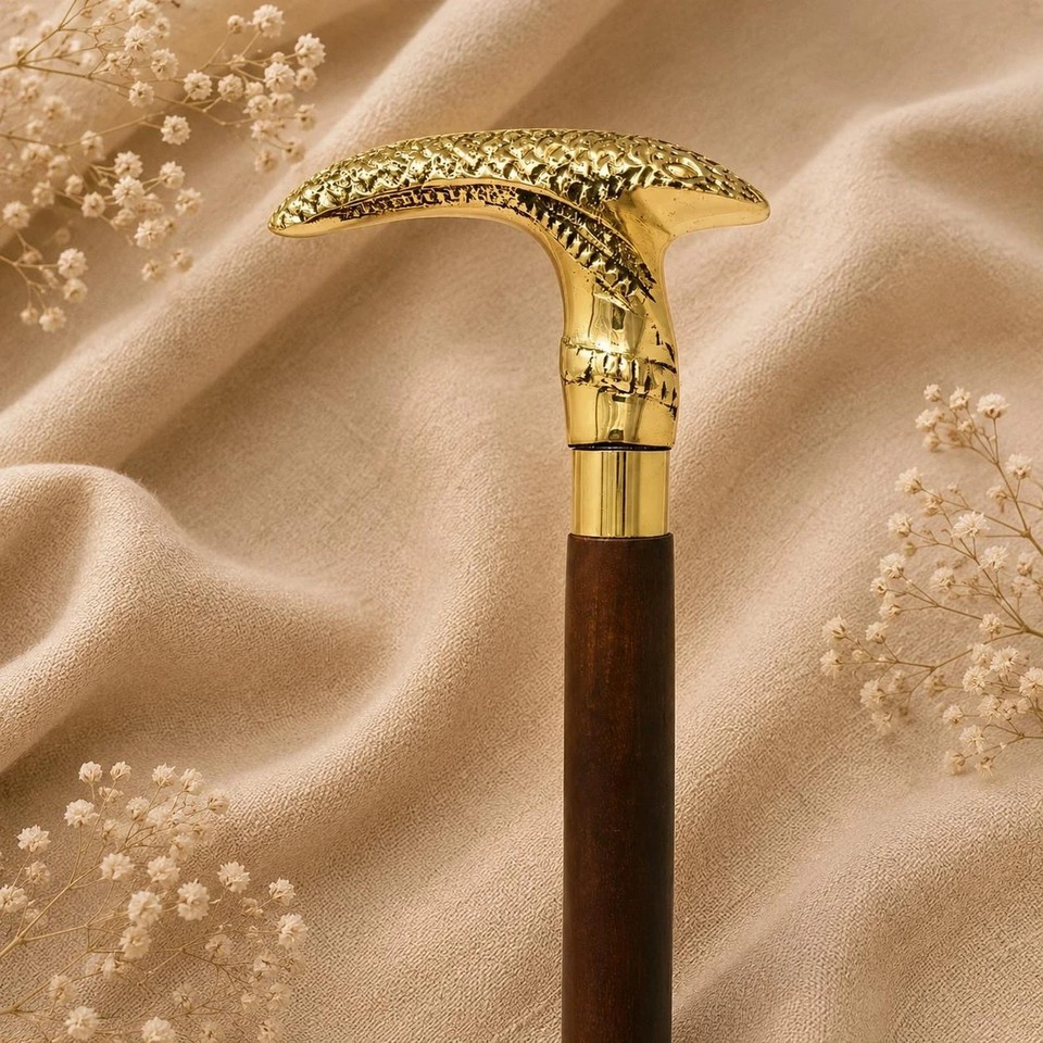 A brass derby-handled wooden walking cane that channels full Victorian gentleman energy — functional, dapper, and wildly giftable.