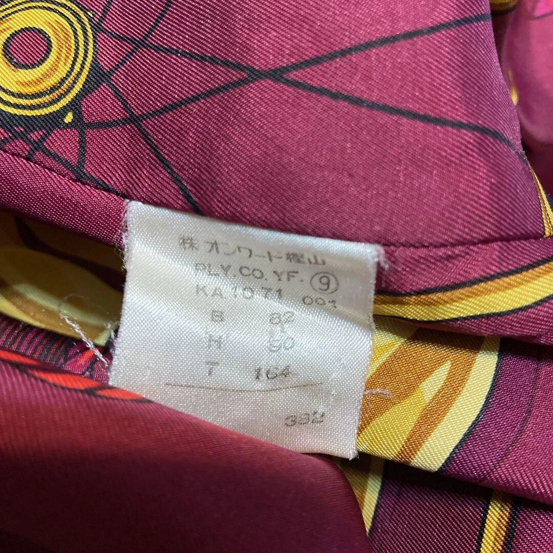 Cappotto lungo Moschino economico e chic fodera sciarpa stampa all over vestito taglia L