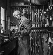 Sergeant Arthur Fulton famous shooter cleans strips one of hundred- Old Photo